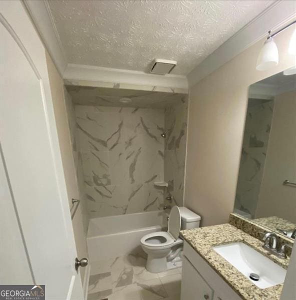 full bathroom featuring ornamental molding, vanity, a textured ceiling, toilet, and tiled shower / bath