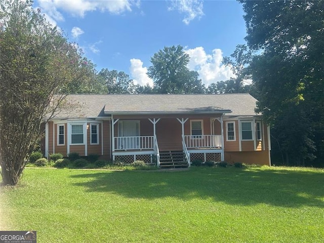 view of front of home featuring covered porch and a front lawn