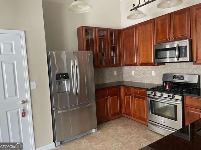 kitchen featuring backsplash and appliances with stainless steel finishes