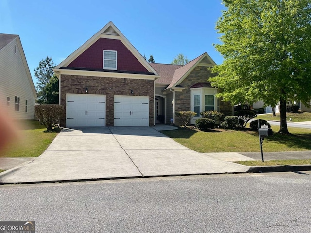 view of front of property with a front yard and a garage