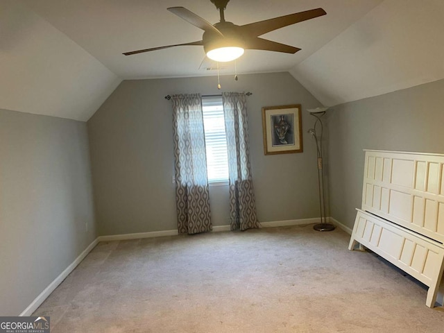 bonus room with ceiling fan, light colored carpet, and lofted ceiling