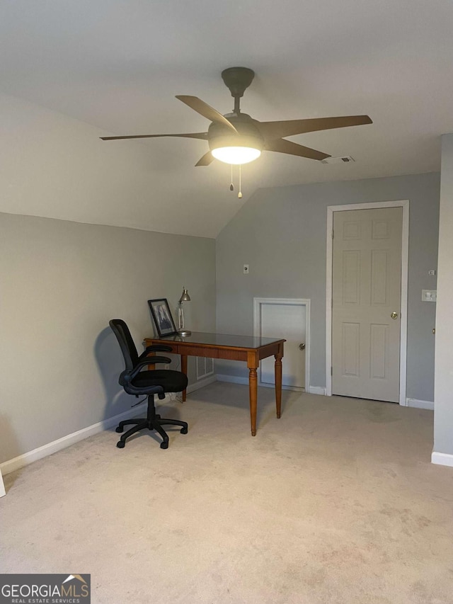 carpeted office space featuring ceiling fan and lofted ceiling