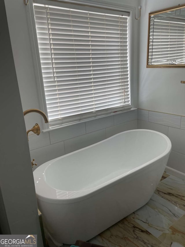 bathroom featuring a bath