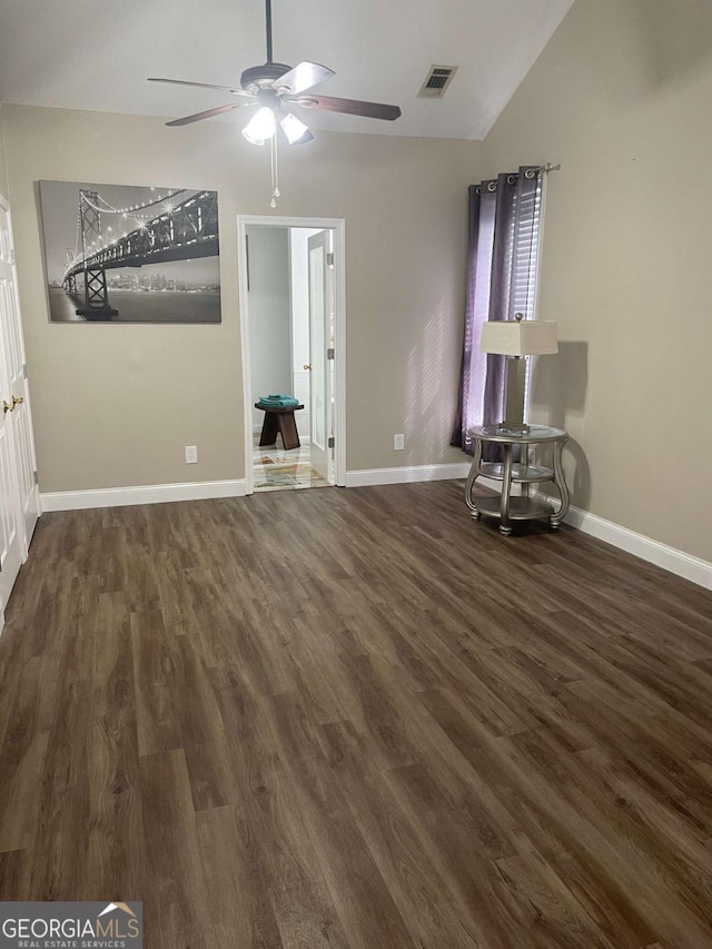 interior space featuring dark hardwood / wood-style floors, ceiling fan, and lofted ceiling