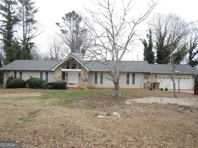 ranch-style home featuring a garage