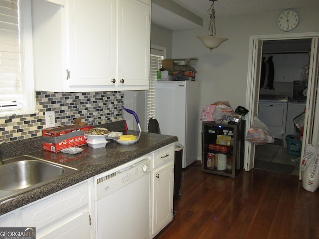 kitchen featuring white cabinetry, sink, white appliances, and backsplash