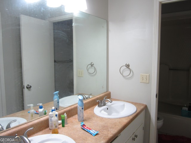 bathroom featuring vanity and toilet