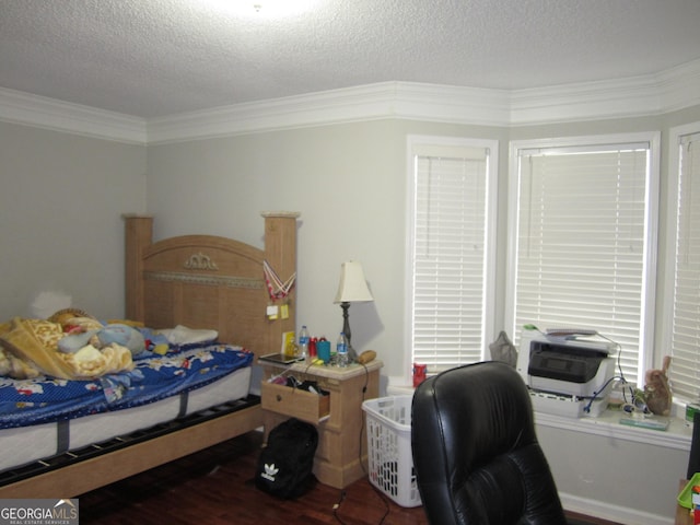 bedroom with hardwood / wood-style floors, a textured ceiling, and crown molding