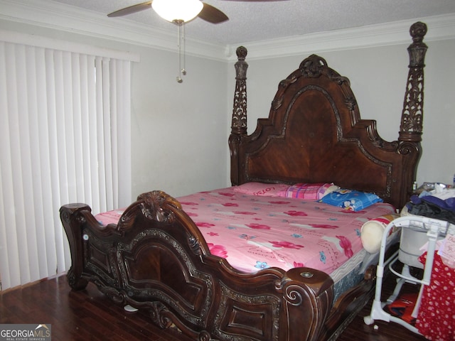 bedroom with a textured ceiling, hardwood / wood-style flooring, ceiling fan, and crown molding