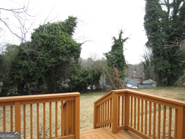 wooden deck with a yard