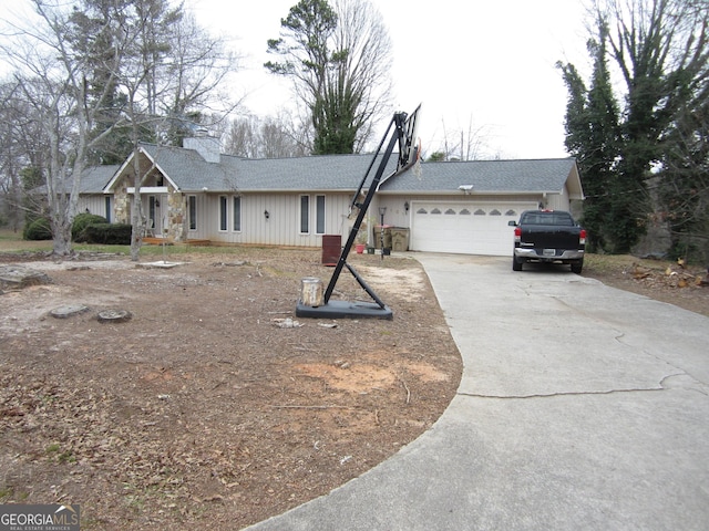 single story home featuring a garage