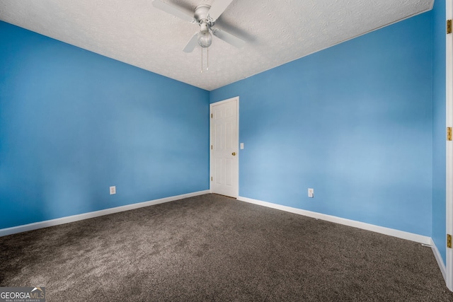 carpeted empty room with a textured ceiling and ceiling fan