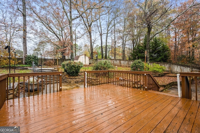 wooden terrace with a storage unit