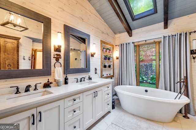 bathroom with a bathing tub, wooden walls, vaulted ceiling with skylight, vanity, and wood ceiling