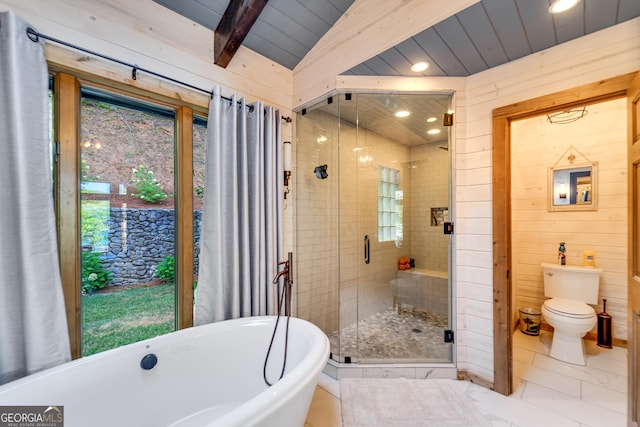 bathroom featuring plus walk in shower, lofted ceiling with beams, and toilet