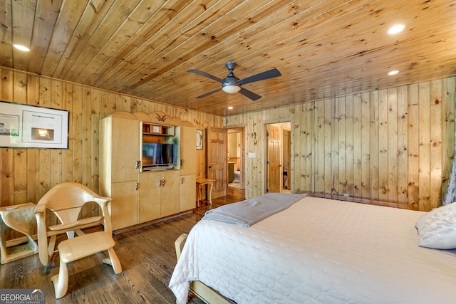 bedroom featuring dark hardwood / wood-style flooring, ceiling fan, wood walls, and wood ceiling