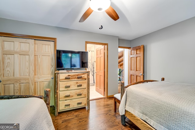 bedroom featuring a closet, hardwood / wood-style flooring, and ceiling fan