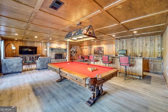 recreation room featuring a stone fireplace, wood ceiling, coffered ceiling, and billiards