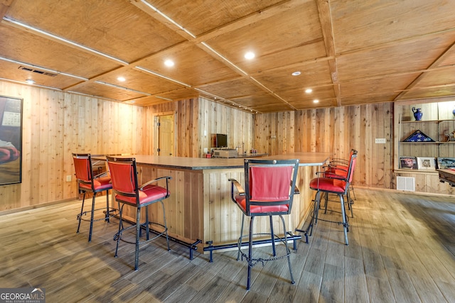 bar with wooden ceiling, coffered ceiling, and hardwood / wood-style flooring