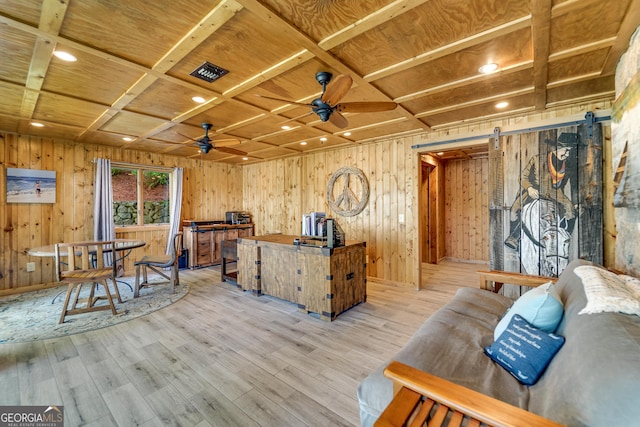 office space featuring coffered ceiling, ceiling fan, a barn door, light hardwood / wood-style floors, and wood ceiling