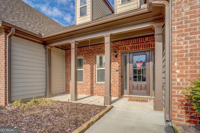 entrance to property featuring covered porch