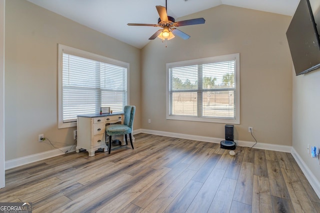 office with hardwood / wood-style flooring, ceiling fan, and vaulted ceiling