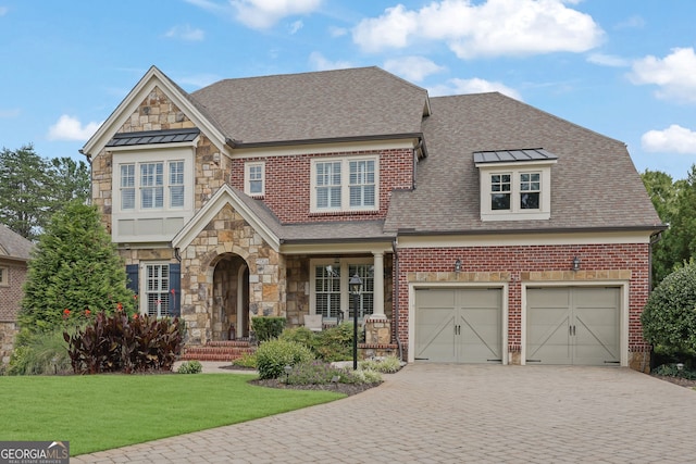 view of front facade with a garage and a front lawn