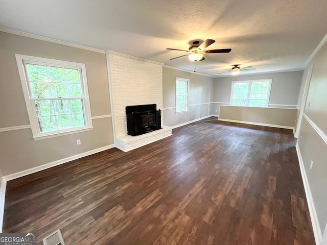 unfurnished living room with ceiling fan, dark hardwood / wood-style flooring, and ornamental molding