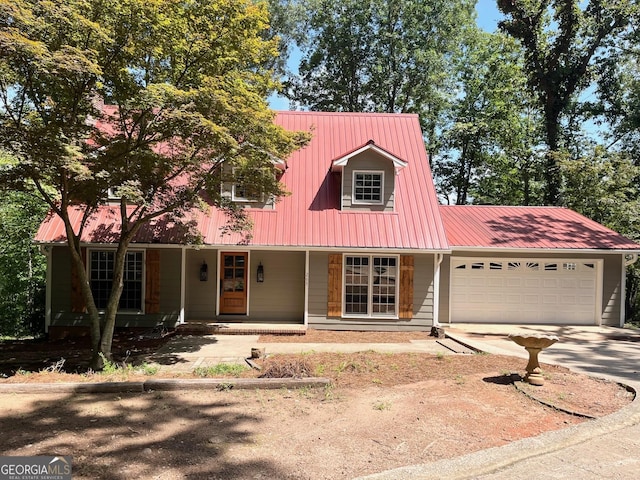 new england style home with a porch and a garage