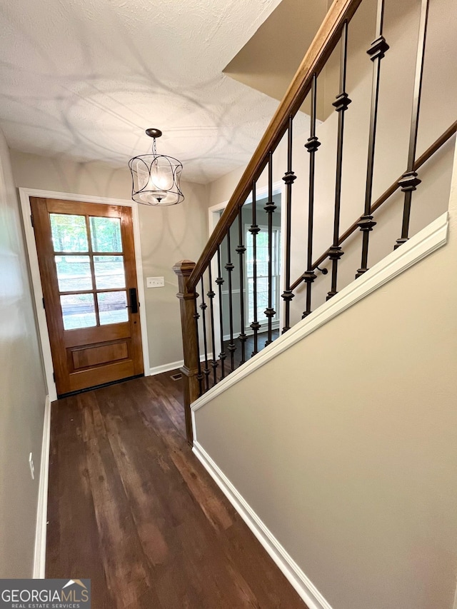 doorway featuring dark hardwood / wood-style flooring