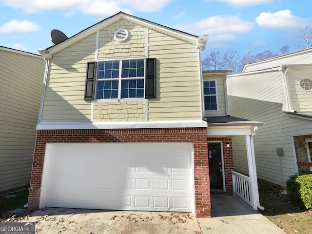 front of property with a garage