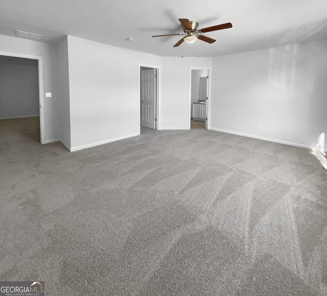 spare room with ceiling fan and carpet floors