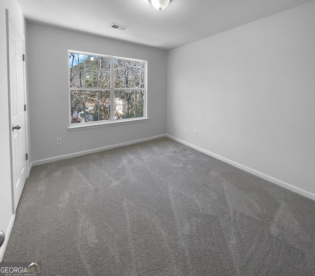 unfurnished room featuring carpet floors