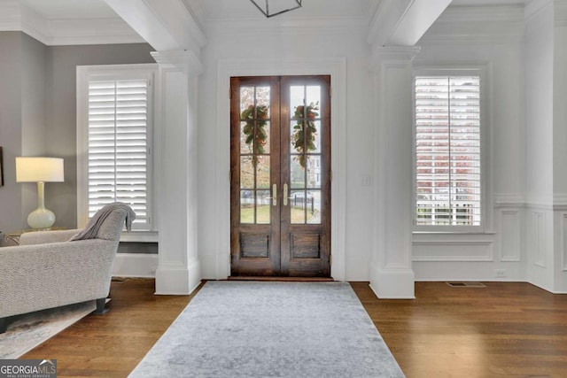 foyer entrance with plenty of natural light, dark wood-type flooring, and french doors