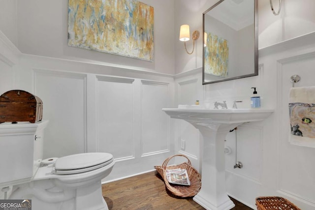 bathroom featuring hardwood / wood-style floors and toilet