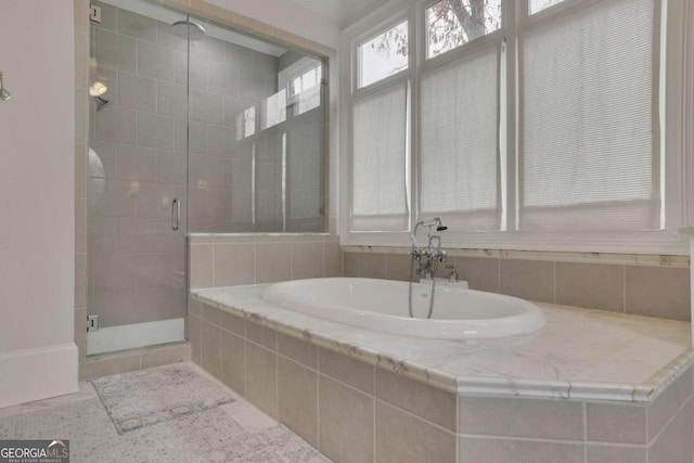 bathroom with tile patterned floors and separate shower and tub