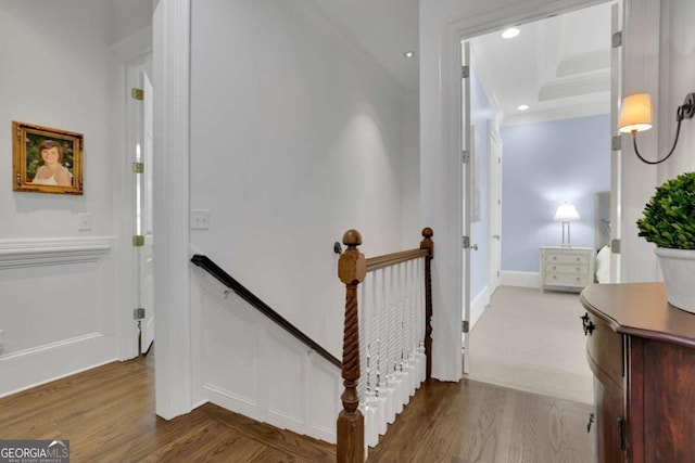 stairway with hardwood / wood-style flooring and coffered ceiling