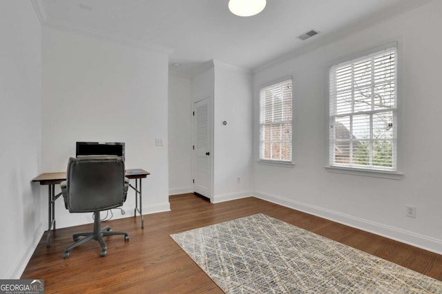 office area featuring dark hardwood / wood-style floors, a healthy amount of sunlight, and crown molding