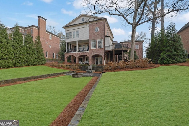 rear view of house with a yard