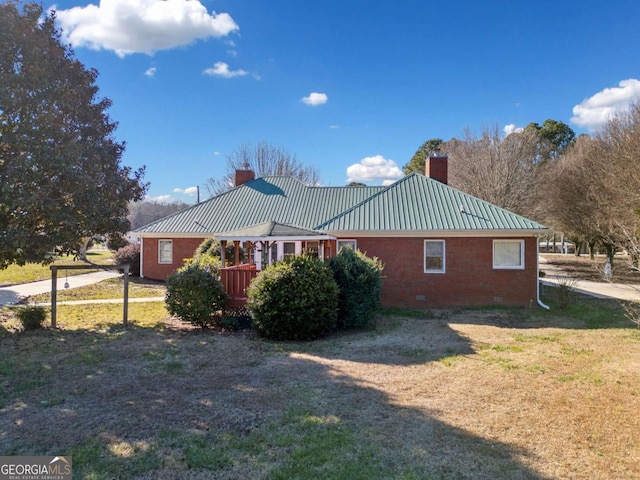 view of property exterior with a lawn