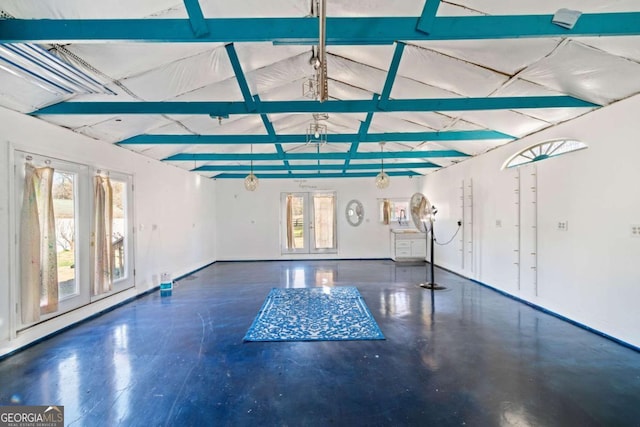 interior space featuring lofted ceiling with beams