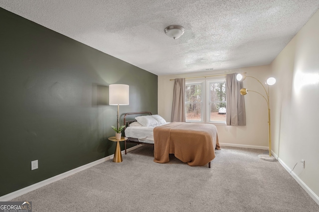 carpeted bedroom featuring a textured ceiling