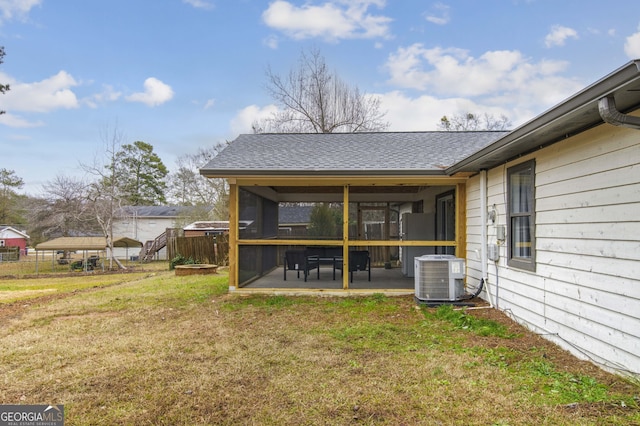 exterior space featuring a sunroom and central AC unit