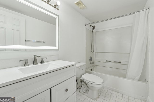 full bathroom with tile patterned floors, vanity, toilet, and shower / tub combo