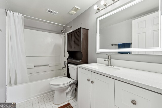 full bathroom with tile patterned flooring, vanity, toilet, and shower / bath combo with shower curtain