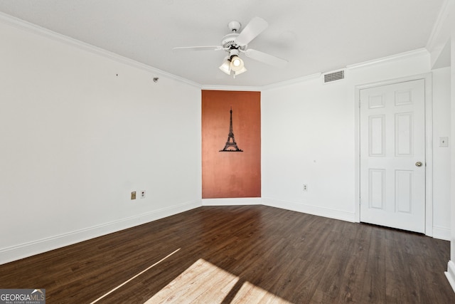 unfurnished room with crown molding, ceiling fan, and dark wood-type flooring