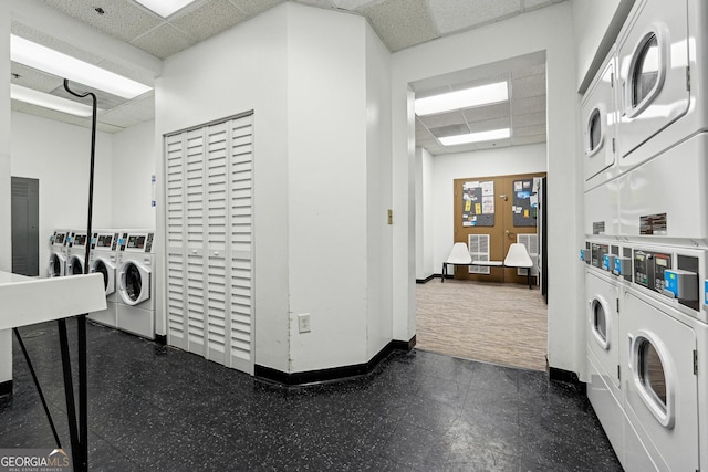 washroom with stacked washer and dryer and independent washer and dryer