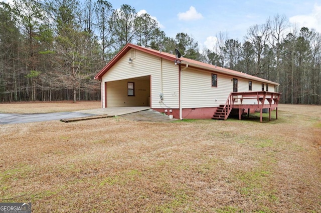 view of property exterior featuring a yard and a deck