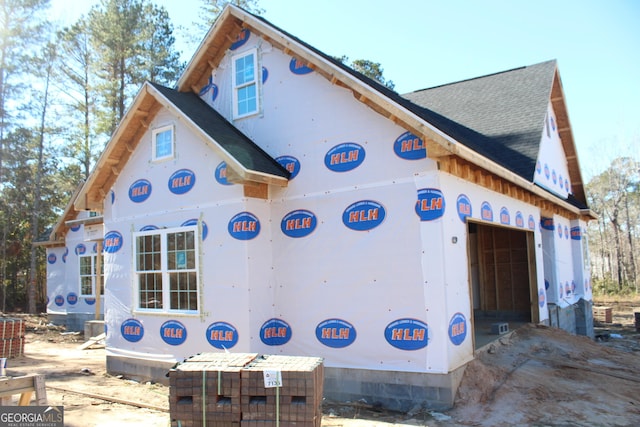 view of side of property with a garage