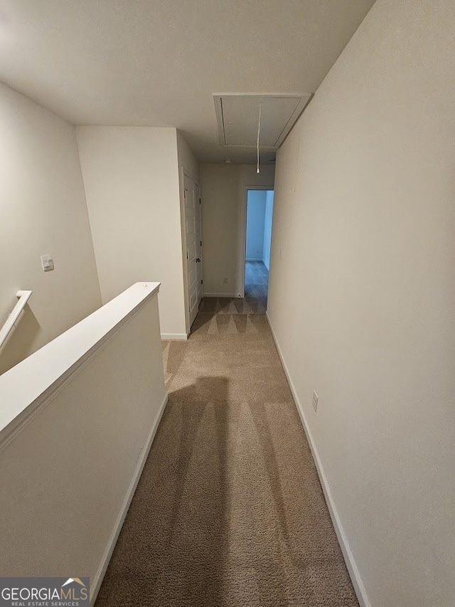 corridor with light colored carpet